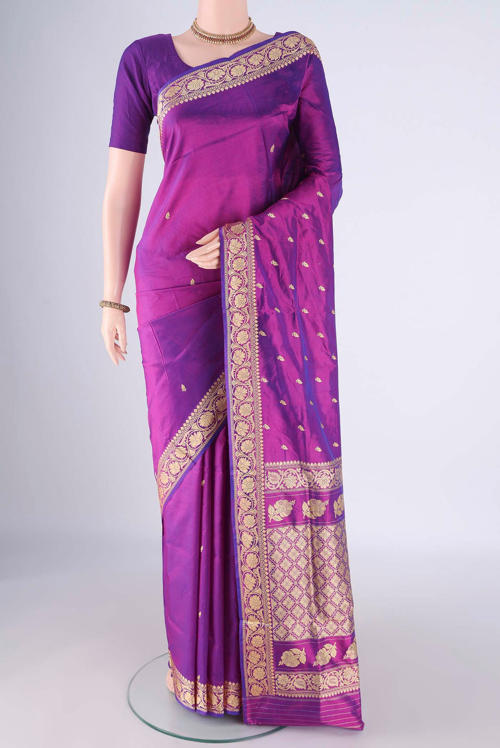 Magenta Banarasi Katan Silk Saree with Thread Butta on the body and Thread Border.  displayed on a mannequin