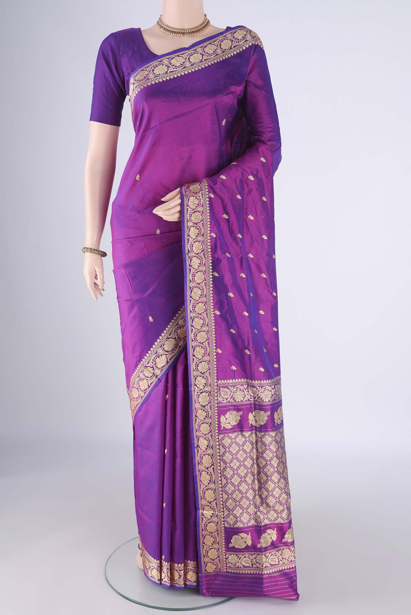 Magenta Banarasi Katan Silk Saree with Thread Butta on the body and Thread Border.  displayed on a mannequin