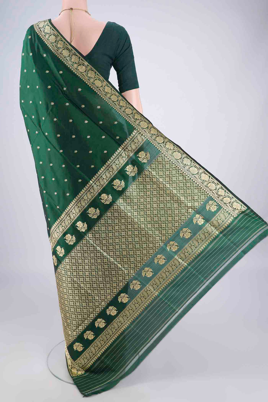 Flat view of Bottle Green Banarasi Katan Silk Saree with Thread Butta on the body and Thread Border. 