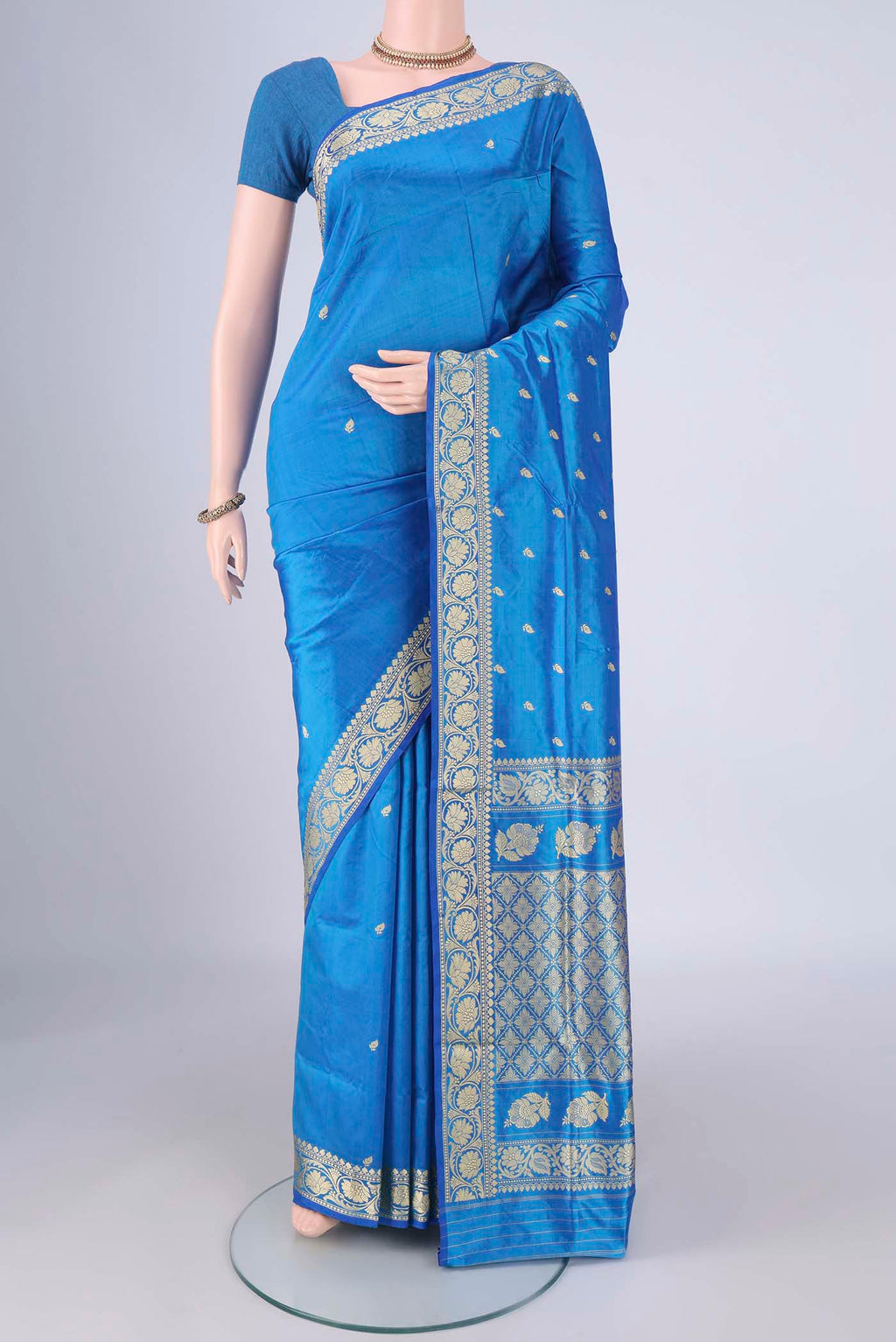 Blue Banarasi Katan Silk Saree with Thread Butta on the body and Thread Border.  displayed on a mannequin