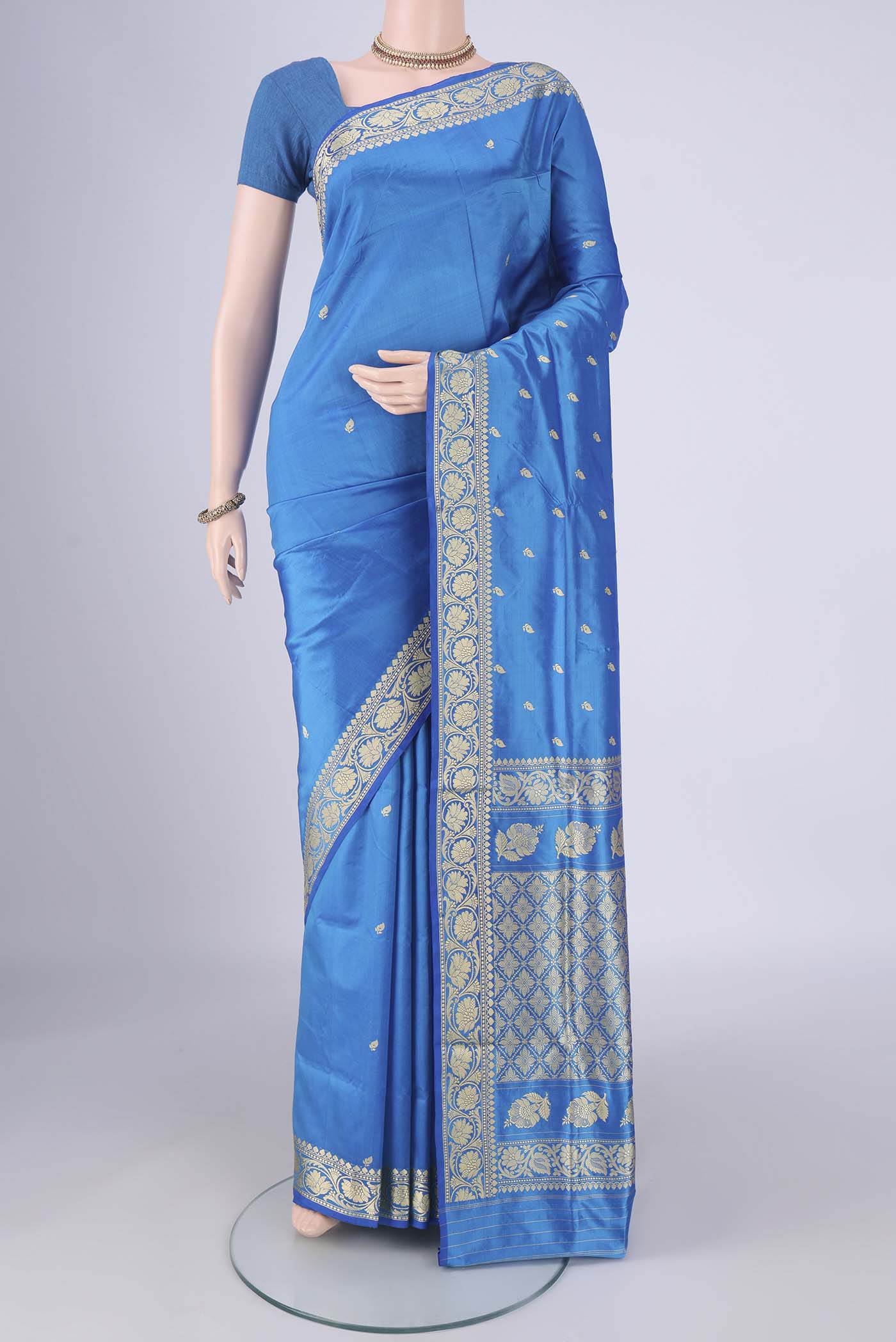 Blue Banarasi Katan Silk Saree with Thread Butta on the body and Thread Border.  displayed on a mannequin