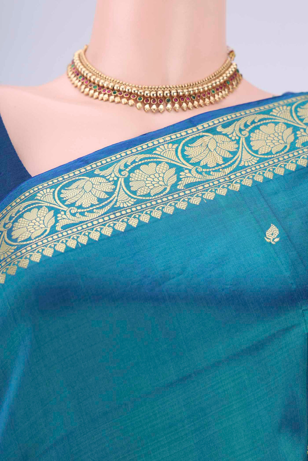 Border image of Peacock Blue Banarasi Katan Silk Saree with Thread Butta on the body and Thread Border. 