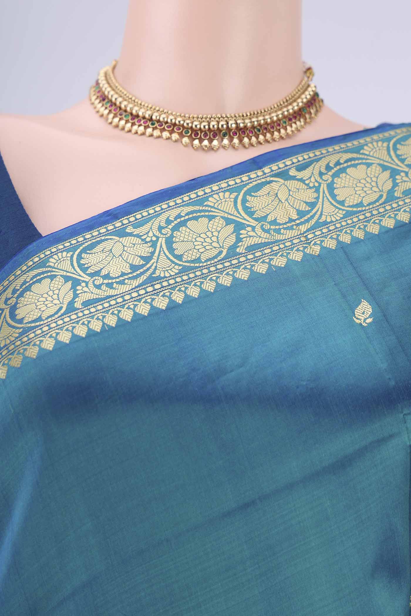 Border image of Peacock Blue Banarasi Katan Silk Saree with Thread Butta on the body and Thread Border. 