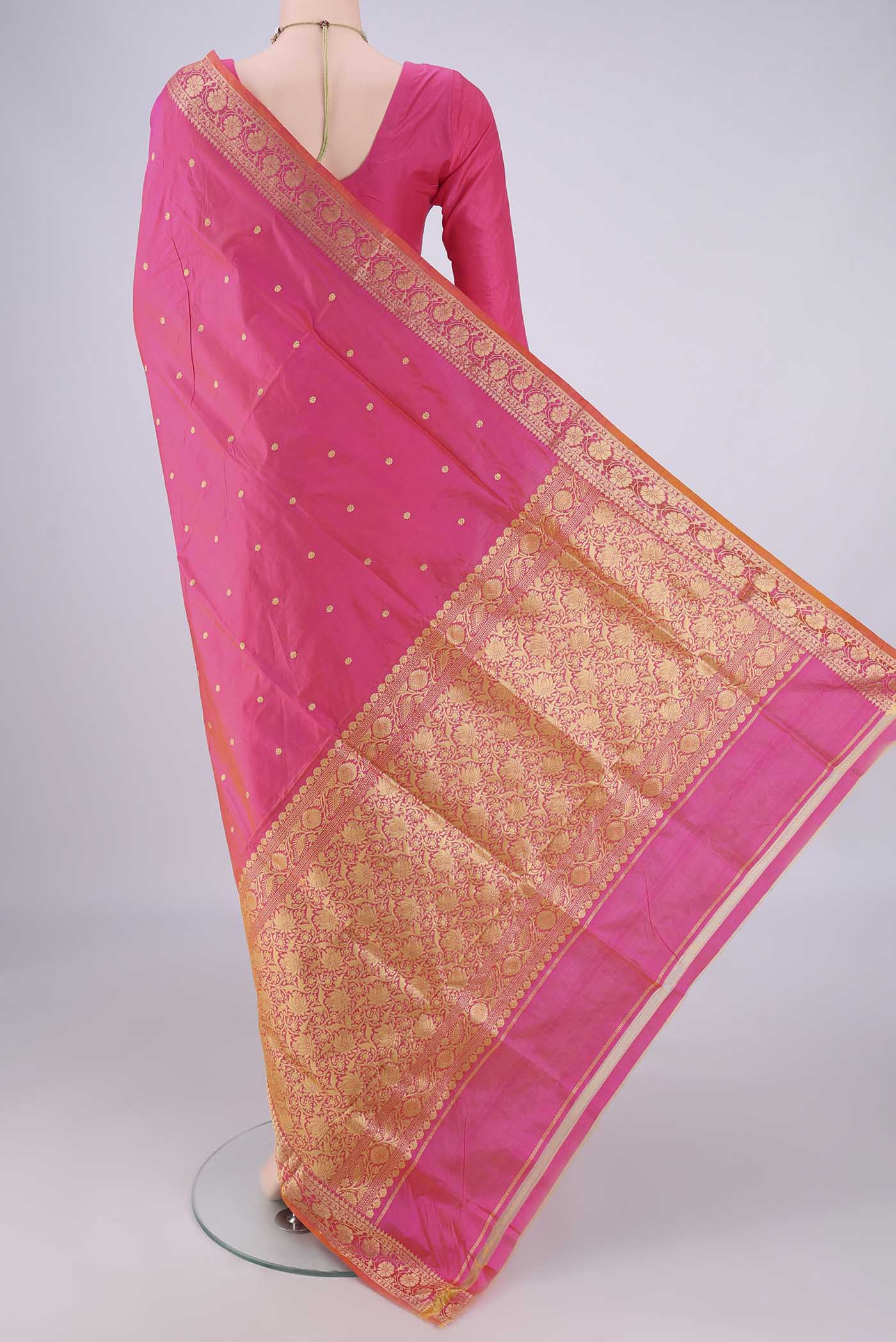 Flat view of Peach Banarasi Katan Silk Saree with Zari Butta on the body and Zari Border. 