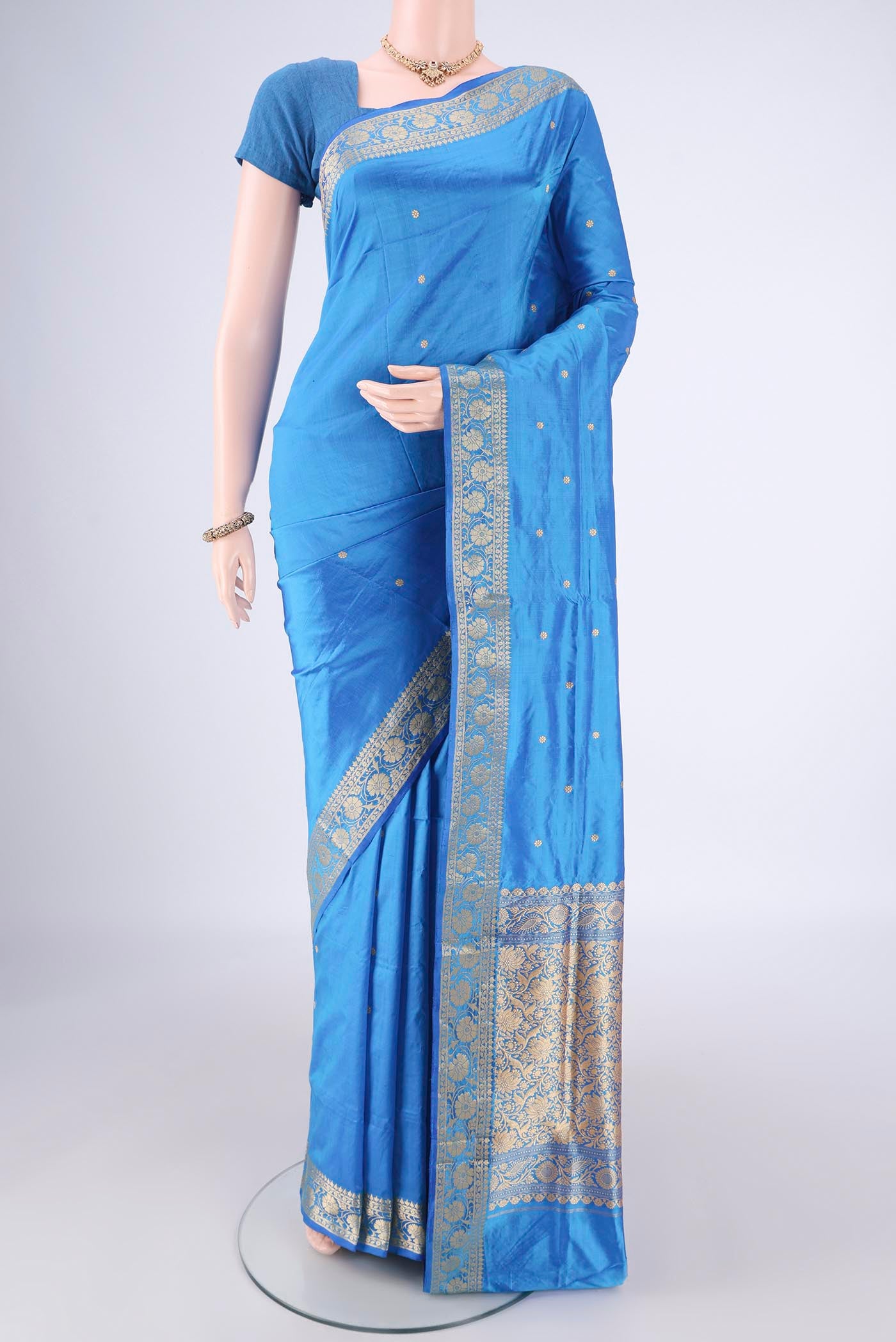 Blue Dual Tone Banarasi Katan Silk Saree with Zari Butta on the body and Zari Border.  displayed on a mannequin
