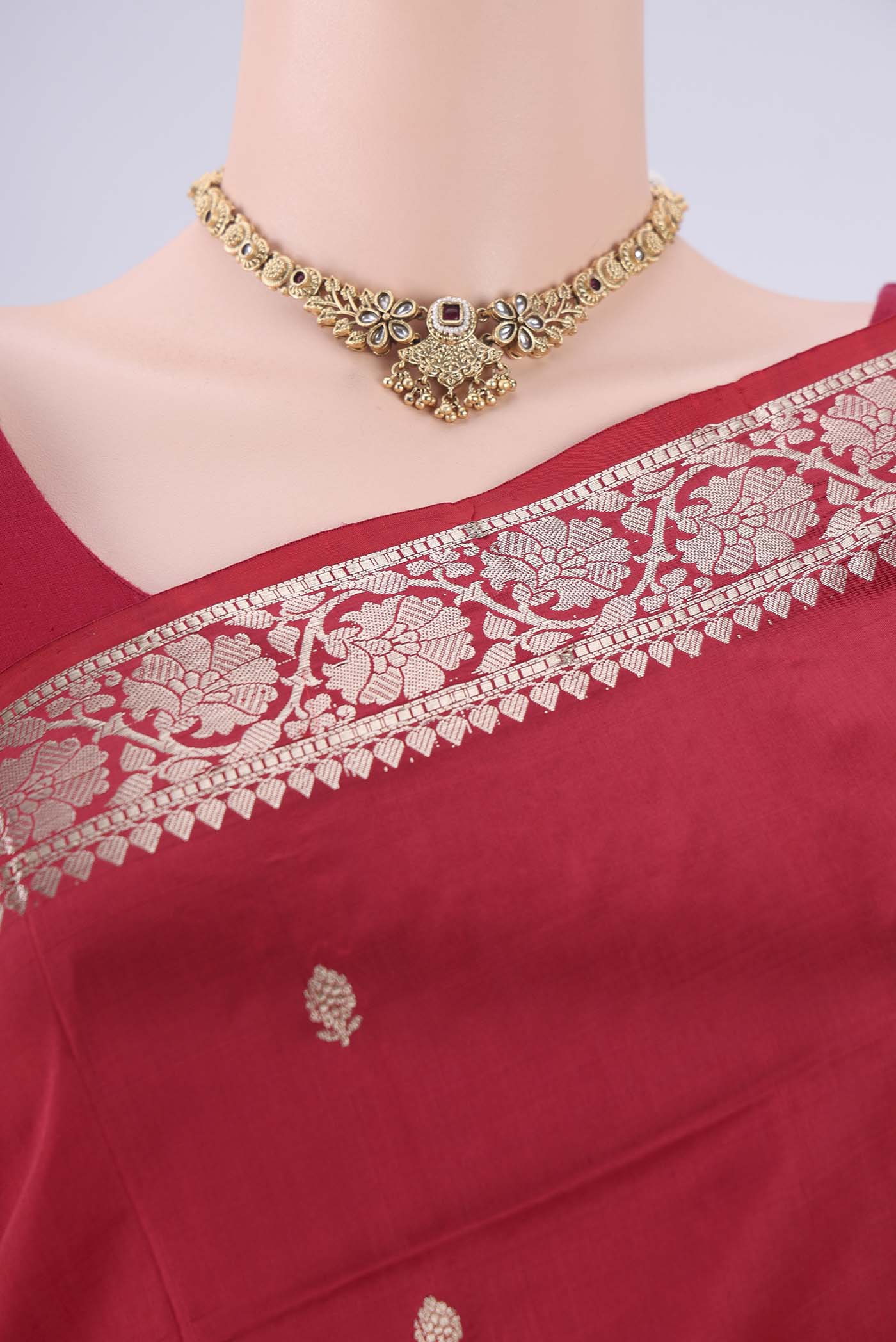 Border image of Maroon Banarasi Katan Silk Saree with Zari Butta on the body and Zari Border. 