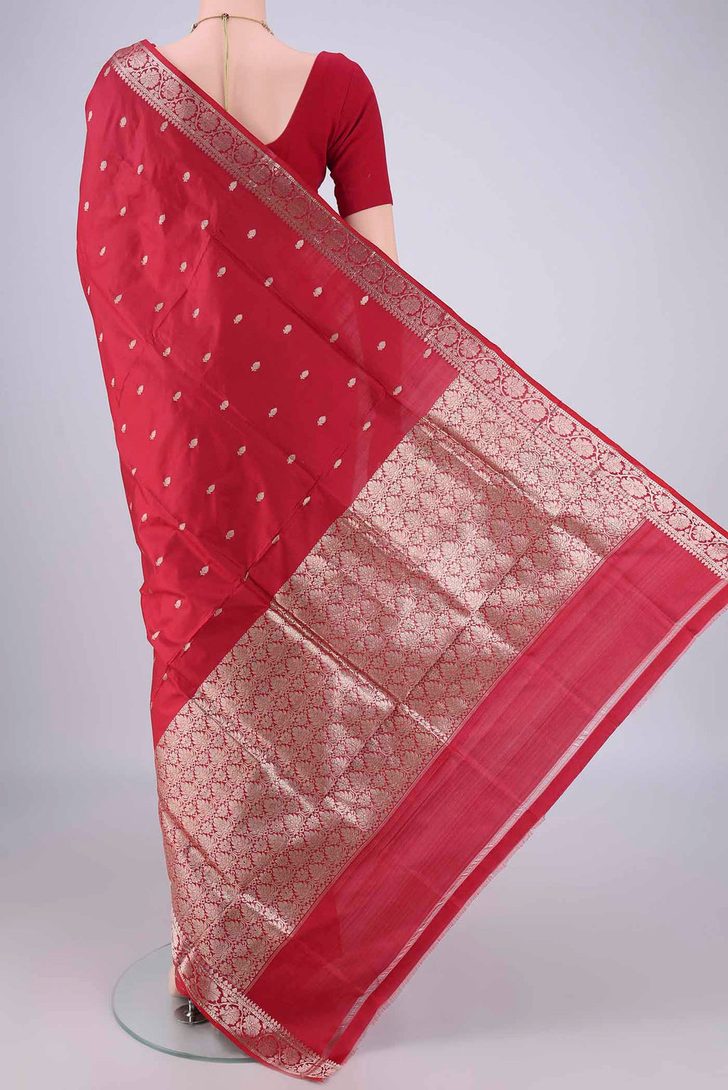 Flat view of Maroon Banarasi Katan Silk Saree with Zari Butta on the body and Zari Border. 