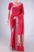 Dark Pink Banarasi Katan Silk Saree with Zari Butta on the body and Zari Border.  displayed on a mannequin