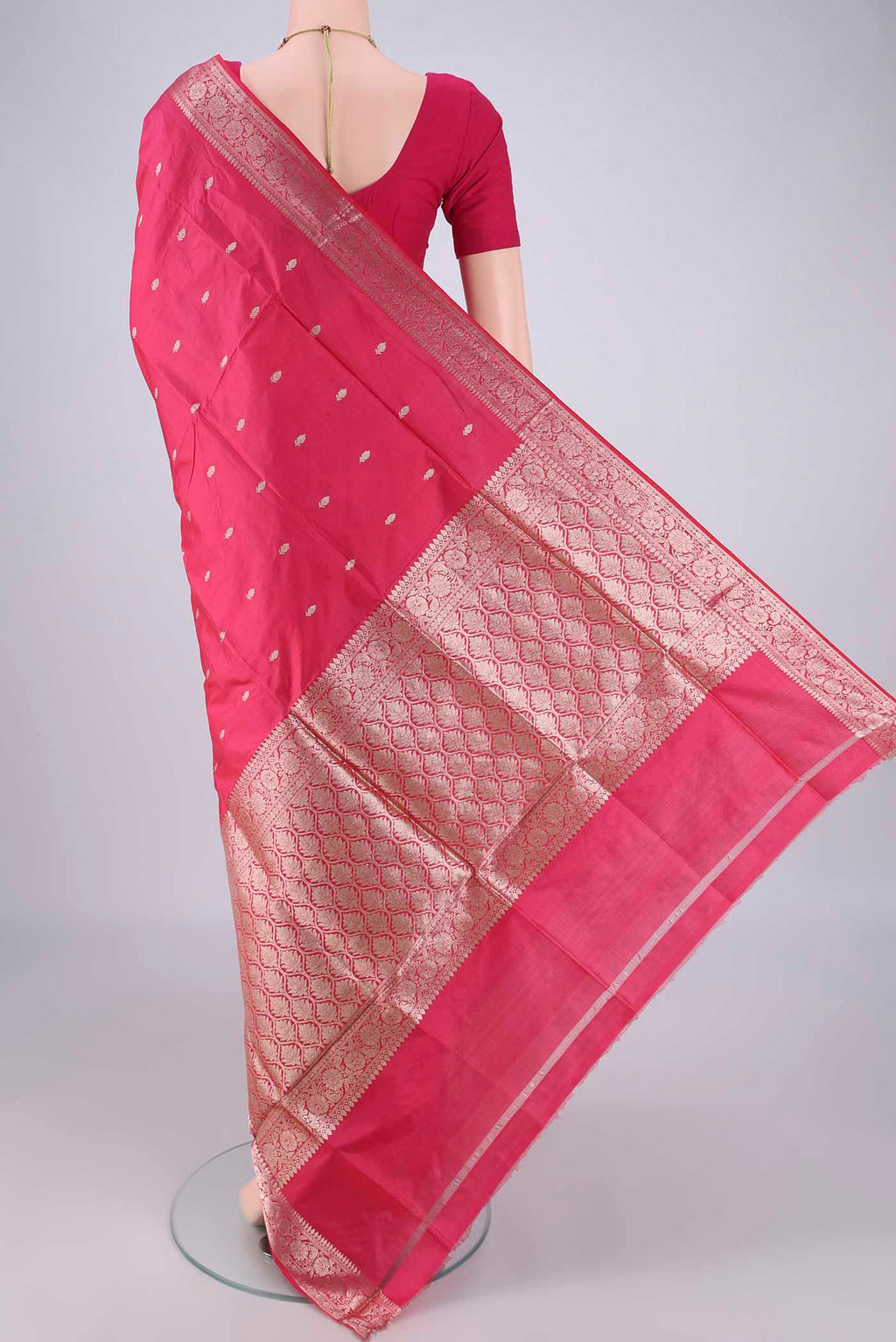 Flat view of Dark Pink Banarasi Katan Silk Saree with Zari Butta on the body and Zari Border. 