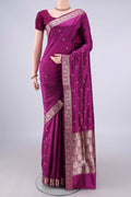 Pure Silk Magenta Banarasi Katan Saree with Zari Butta on the body and Zari Border.  displayed on a mannequin