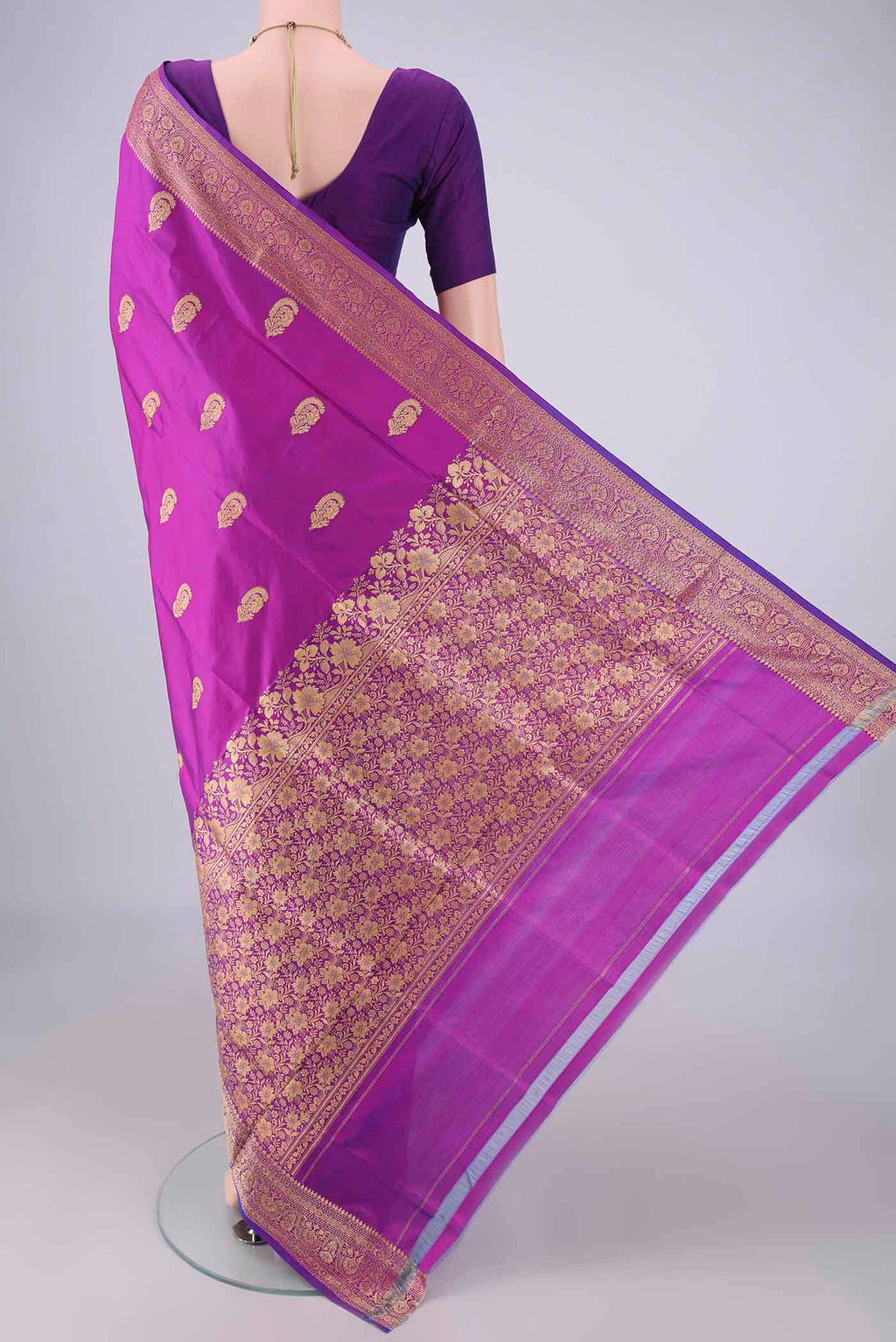 Flat view of Magenta Banarasi Katan Silk Saree with Thread Butta on the body and Thread Border. 