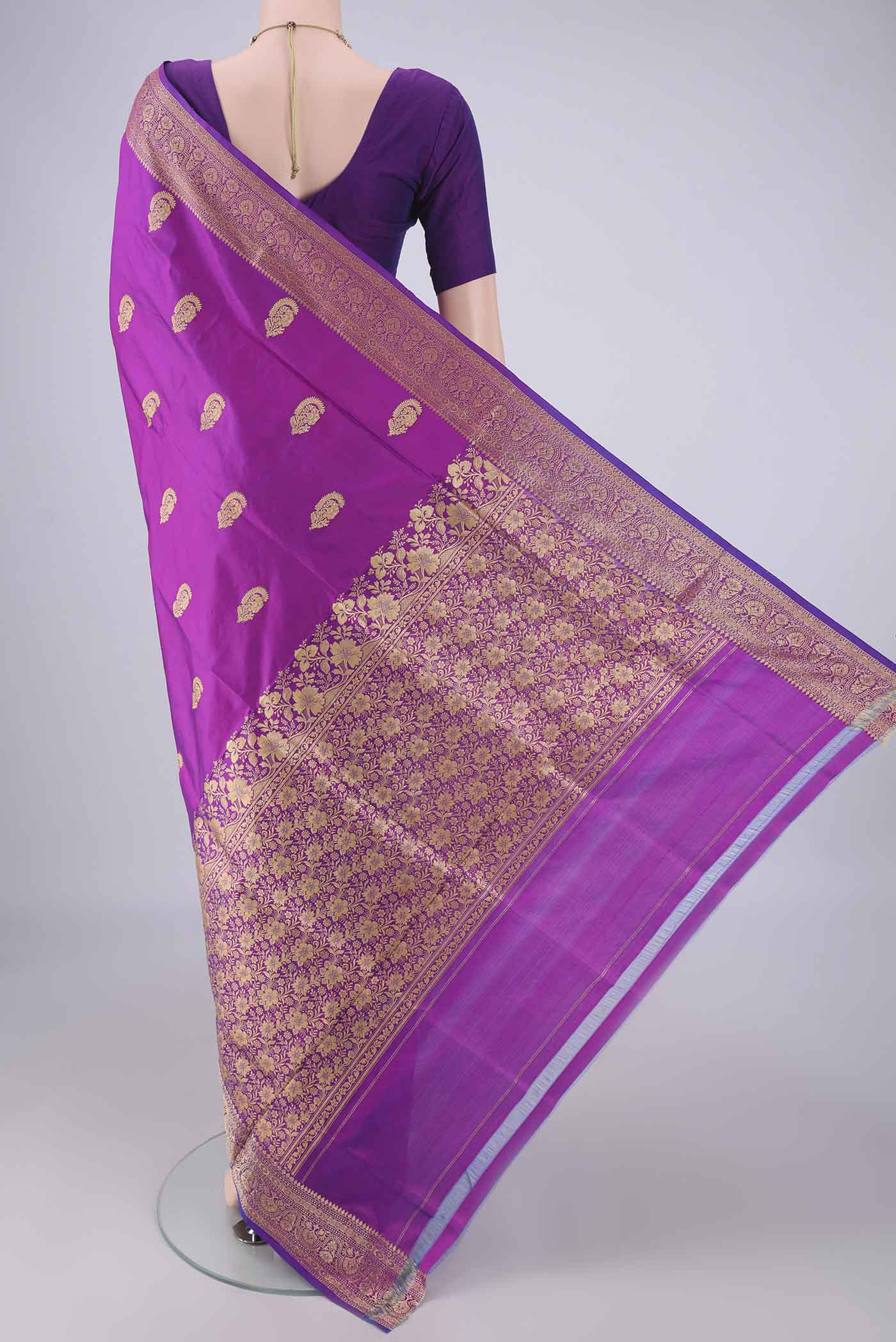 Flat view of Magenta Banarasi Katan Silk Saree with Thread Butta on the body and Thread Border. 