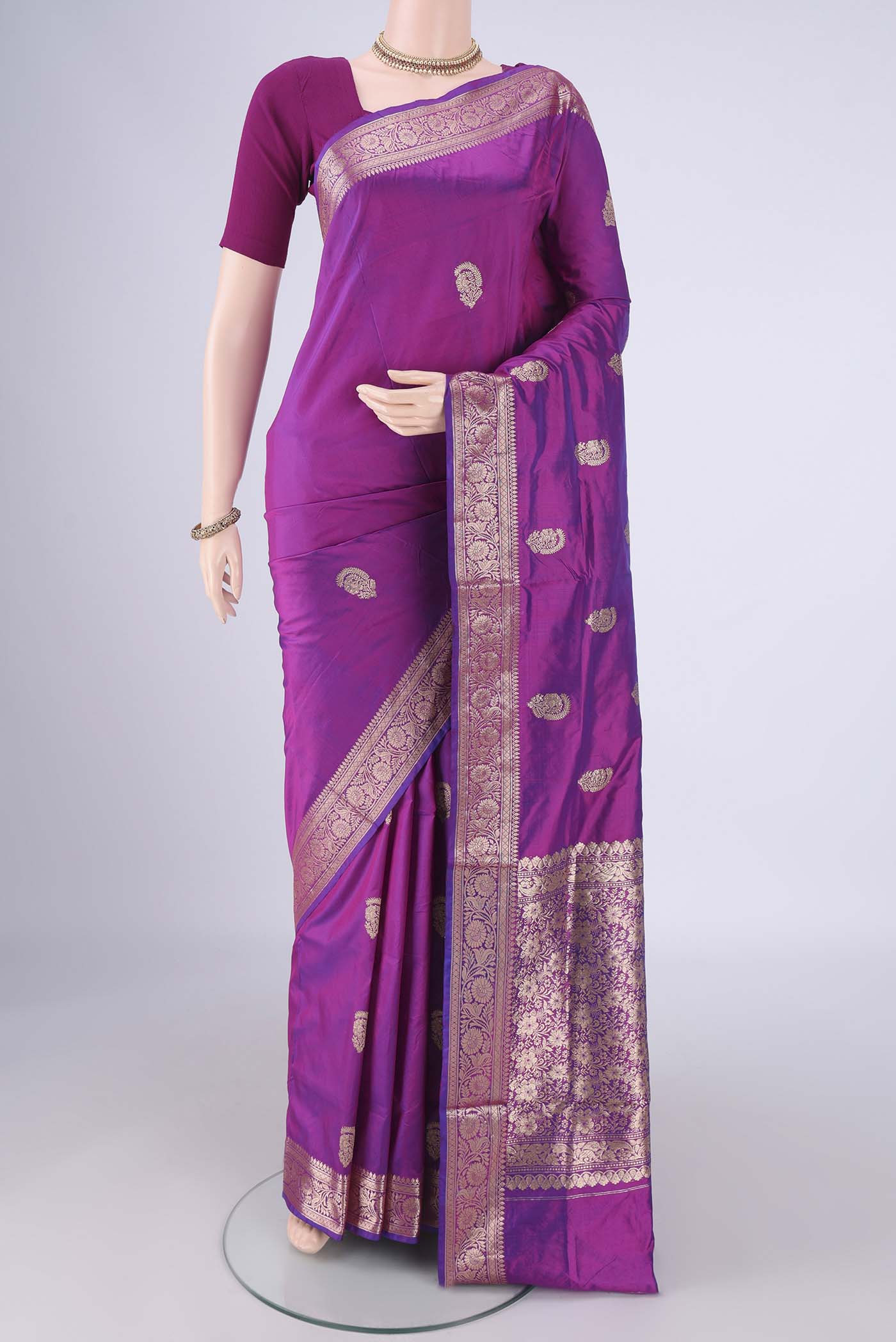 Magenta Dual Tone Banarasi Katan Silk Saree with Zari Butta on the body and Zari Border.  displayed on a mannequin