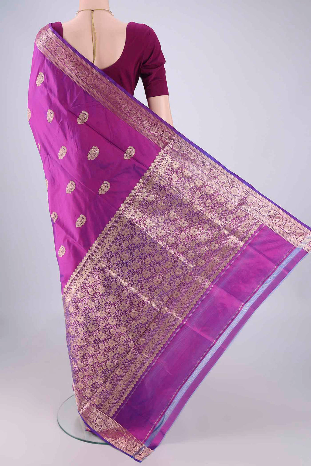 Flat view of Magenta Dual Tone Banarasi Katan Silk Saree with Zari Butta on the body and Zari Border. 
