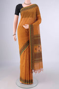 Mustard Kanchi Cotton Saree with Thread Butta on the body and Thread Border.  displayed on a mannequin