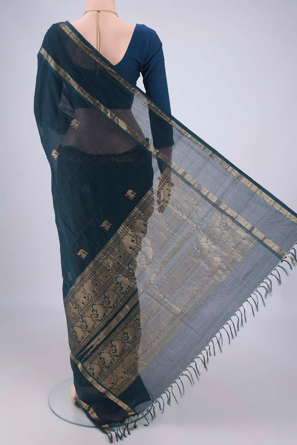 Flat view of Teal Kanchi Cotton Saree with Zari Butta on the body and Zari Border. 
