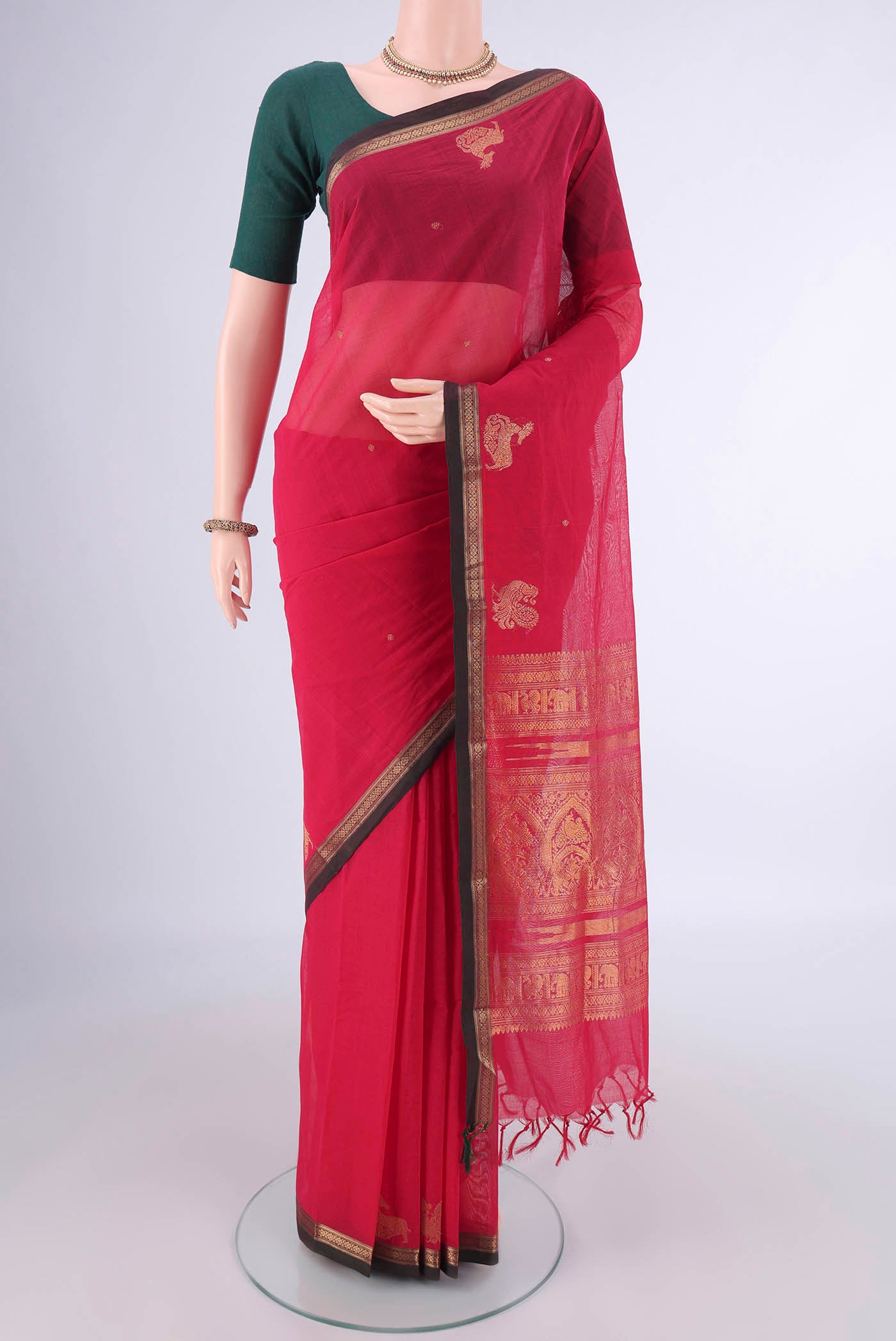 Pink Kanchi Cotton Saree with Zari Butta on the body and Plain Border.  displayed on a mannequin