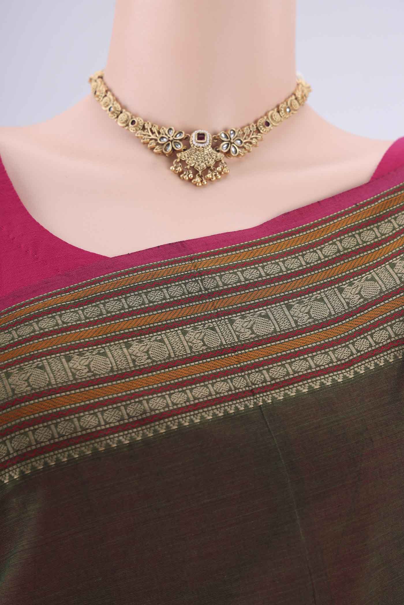 Border image of Mehandi Green Kanchi Cotton Saree with Thread Butta on the body and Thread Border. 