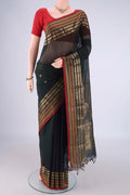 Bottle Green Kanchi Cotton Saree with Zari Butta on the body and Zari Border.  displayed on a mannequin