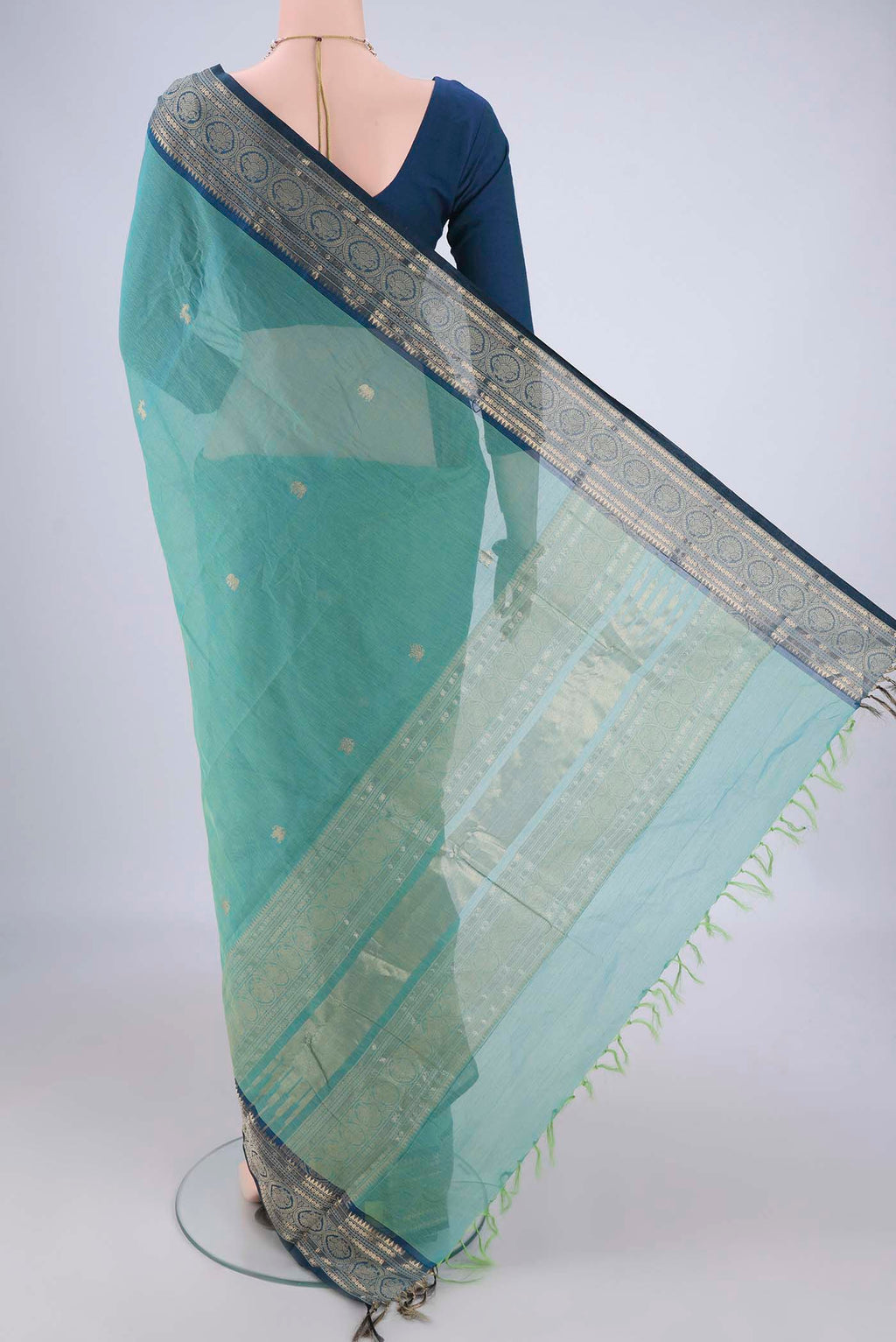 Flat view of Sea Green Kanchi Cotton Saree with Zari Butta on the body and Zari Border. 