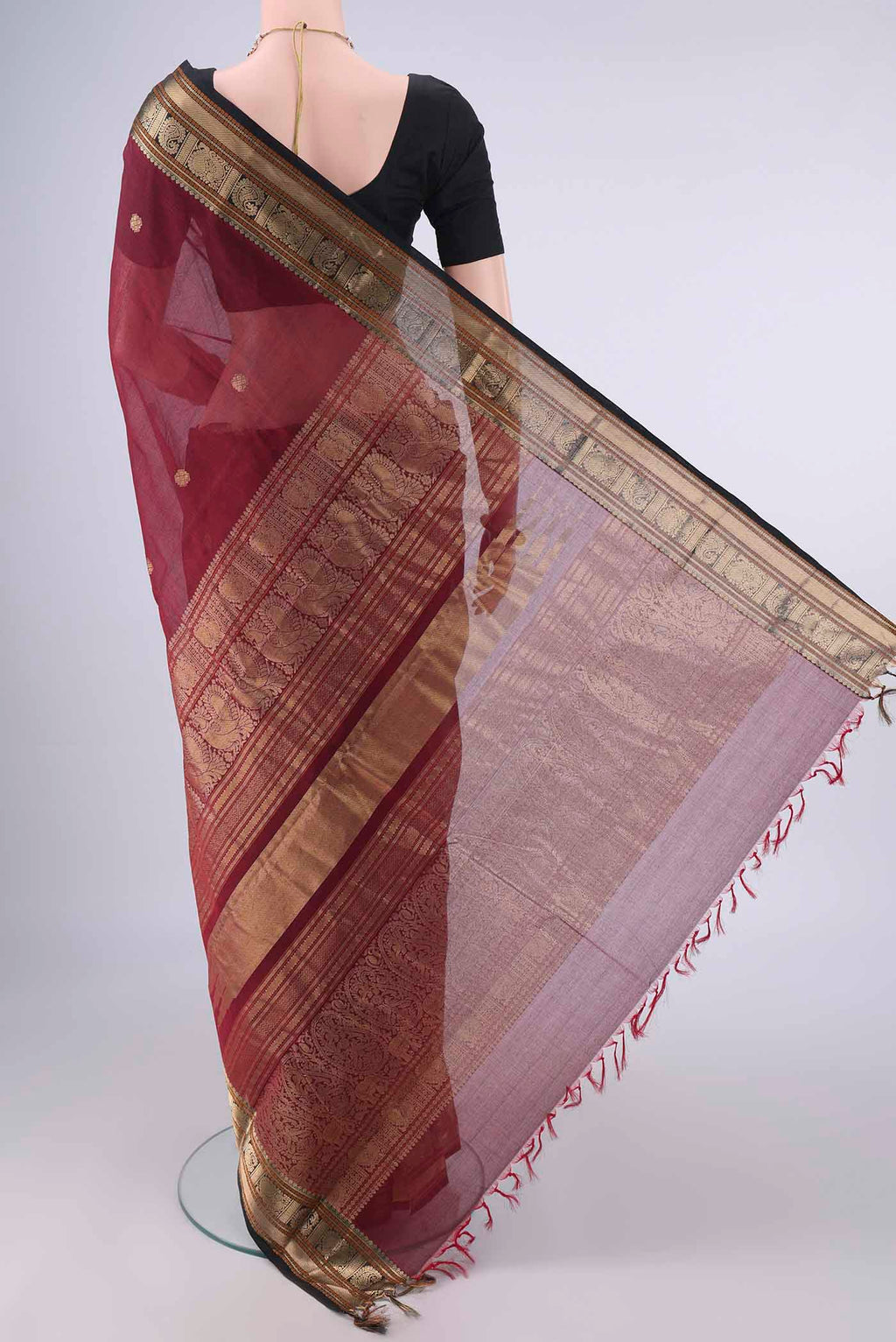 Flat view of Maroon Kanchi Cotton Saree with Zari Butta on the body and Zari Border. 