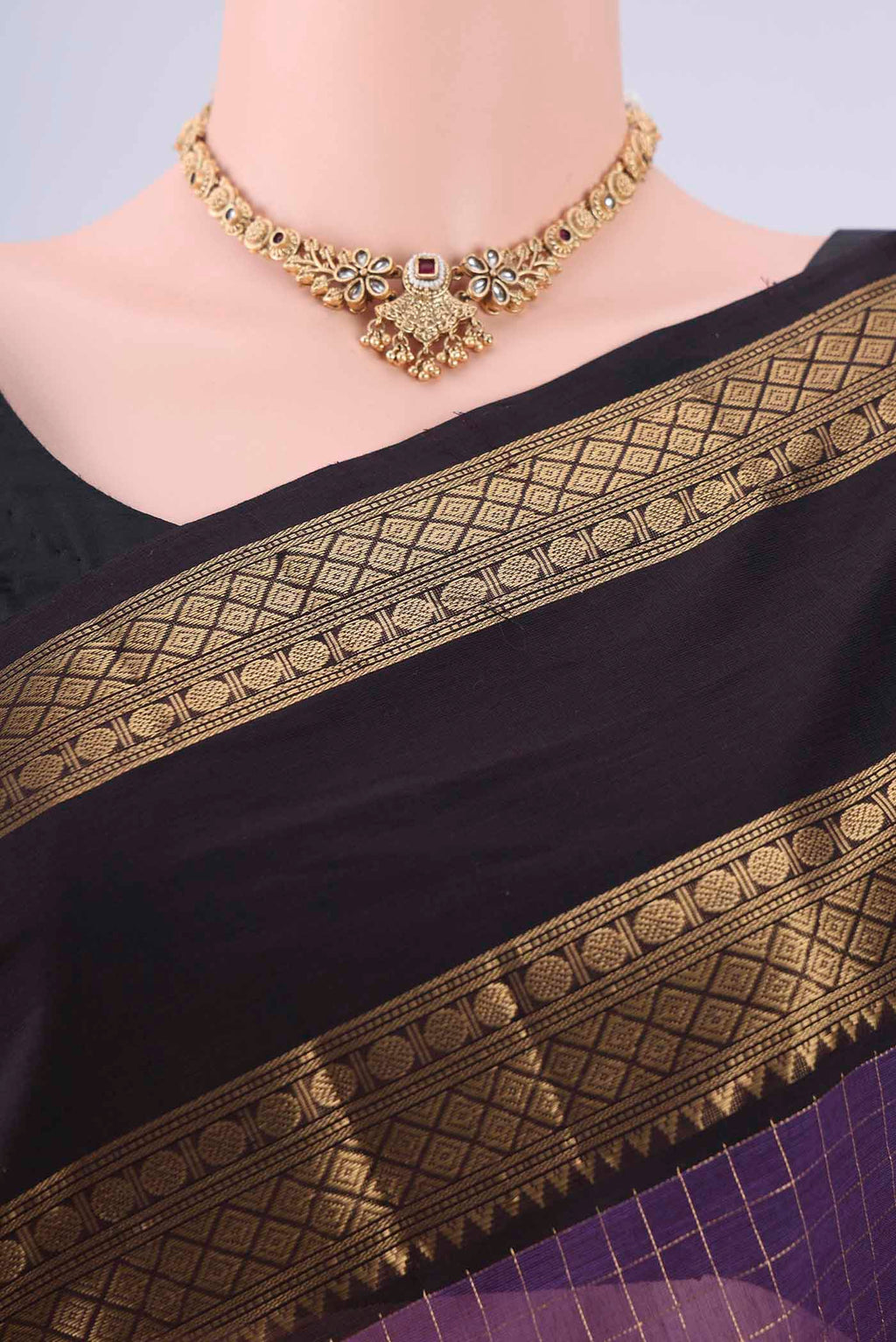 Border image of Purple Kanchi Cotton Saree with Checked design on the body and Zari Border. 
