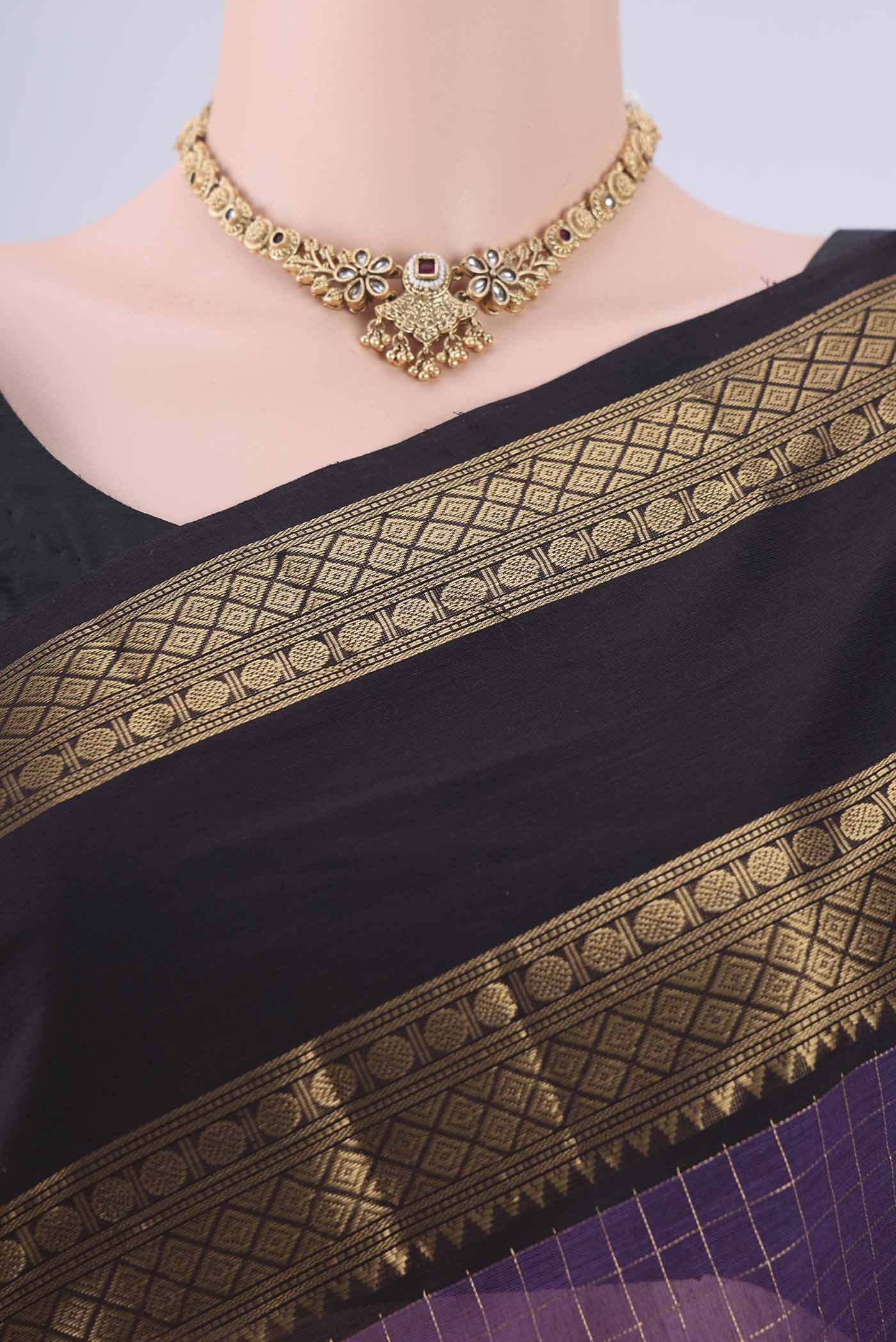 Border image of Purple Kanchi Cotton Saree with Checked design on the body and Zari Border. 
