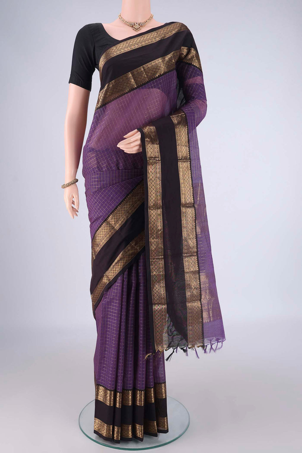 Purple Kanchi Cotton Saree with Checked design on the body and Zari Border.  displayed on a mannequin