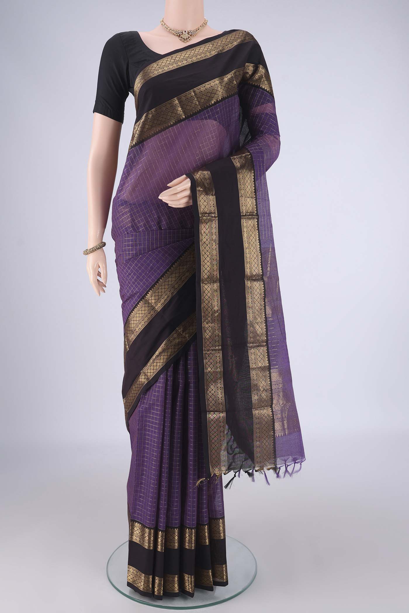 Purple Kanchi Cotton Saree with Checked design on the body and Zari Border.  displayed on a mannequin