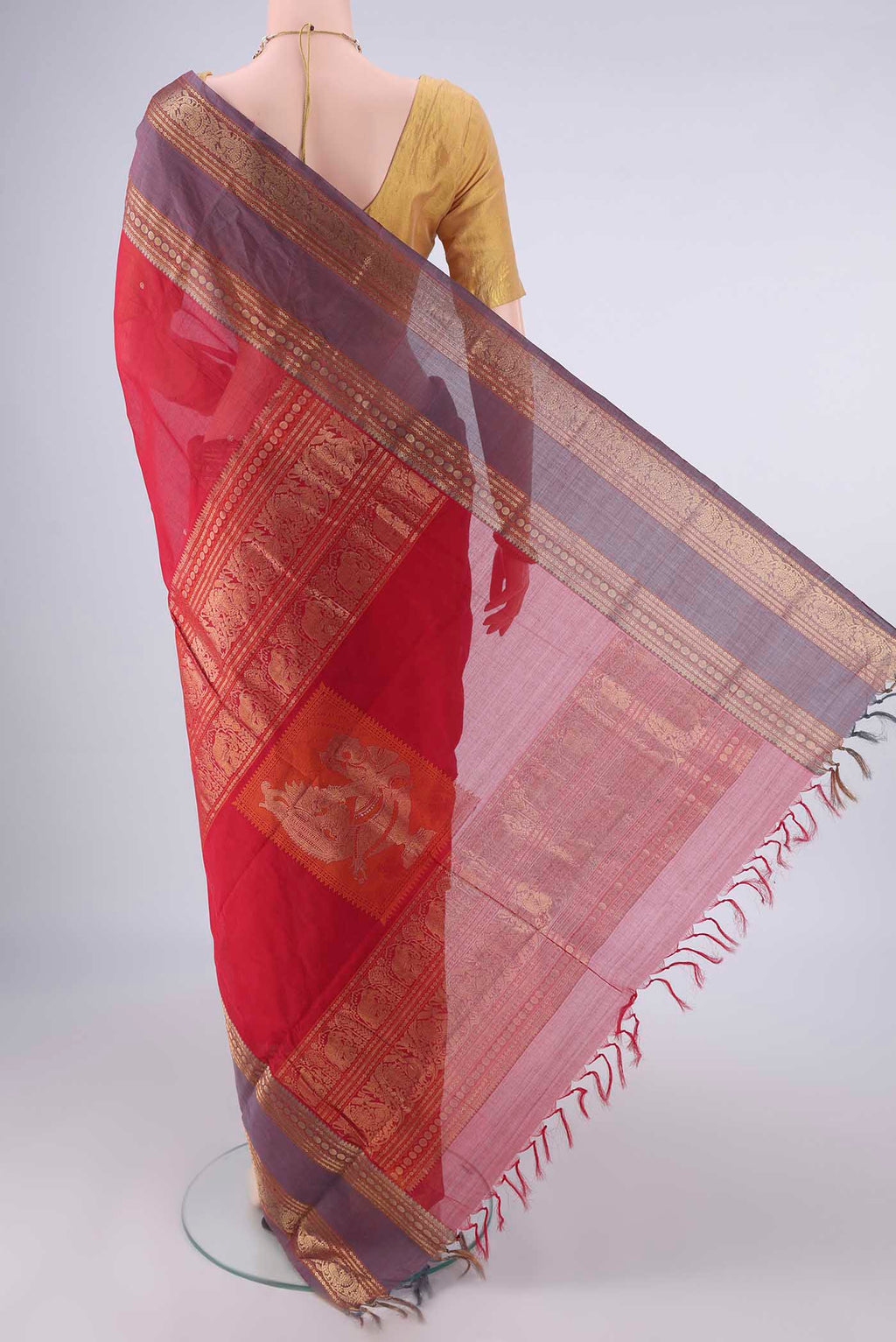 Flat view of Red Kanchi Cotton Saree with Plain Body and Zari Border. 