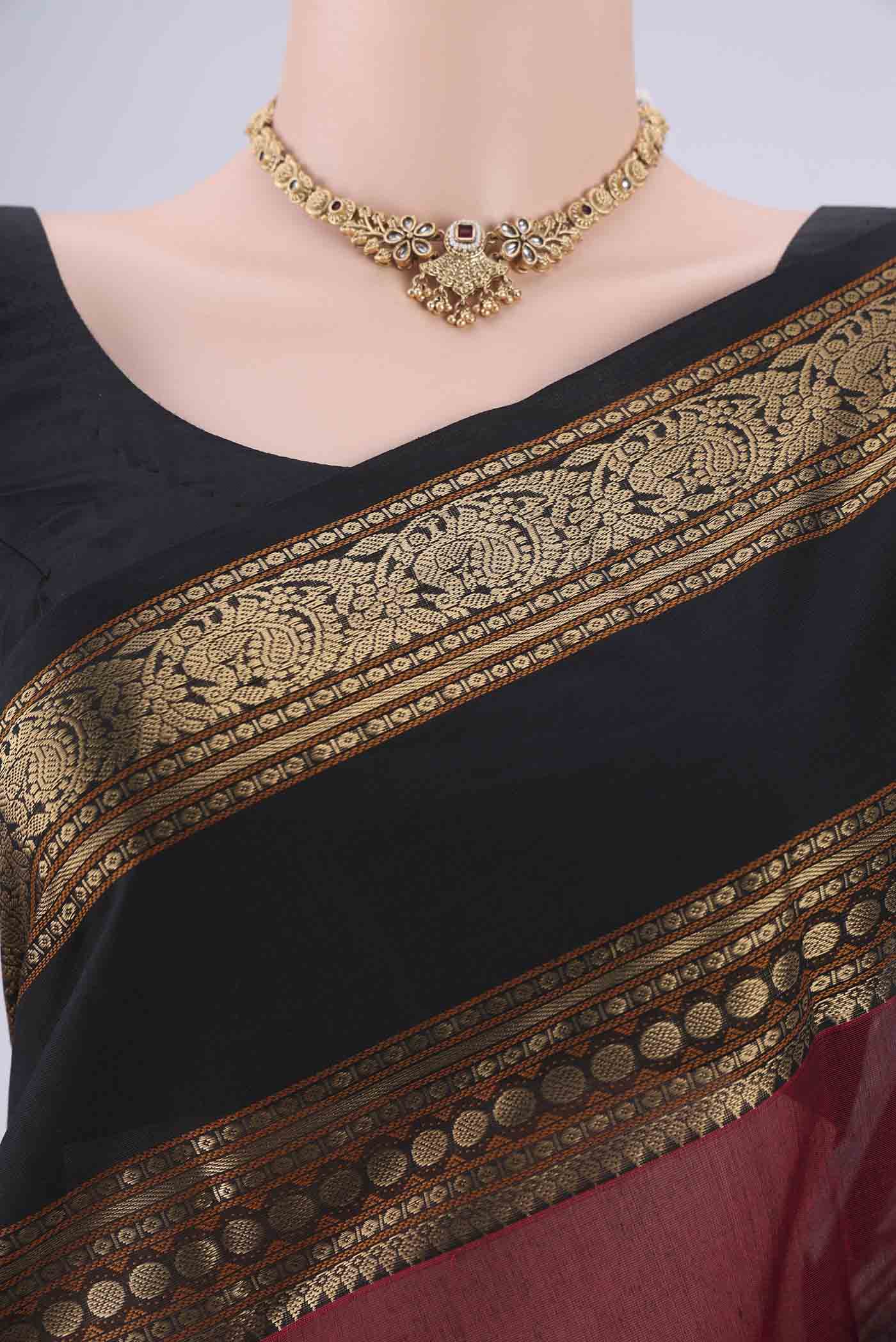 Border image of Maroon Kanchi Cotton Saree with Zari Butta on the body and Zari Border. 