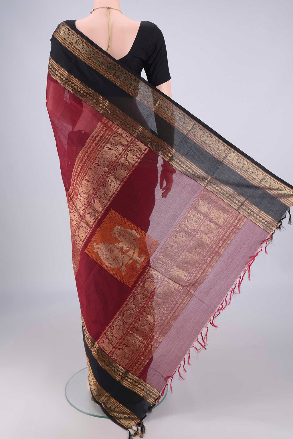 Flat view of Maroon Kanchi Cotton Saree with Zari Butta on the body and Zari Border. 