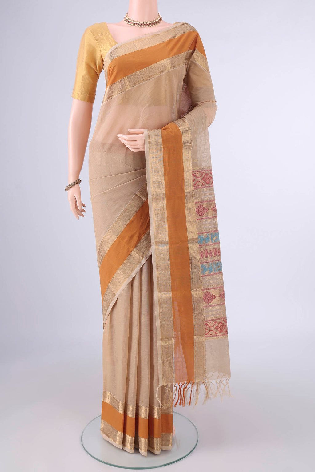 Sandal Kanchi Cotton Saree with Plain Body and Zari Border.  displayed on a mannequin