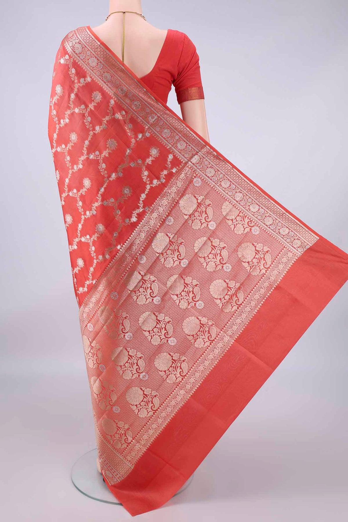 Flat view of Pure Silk Orange Banarasi Raw Saree with Zari Brocade on the body and Zari Border. 