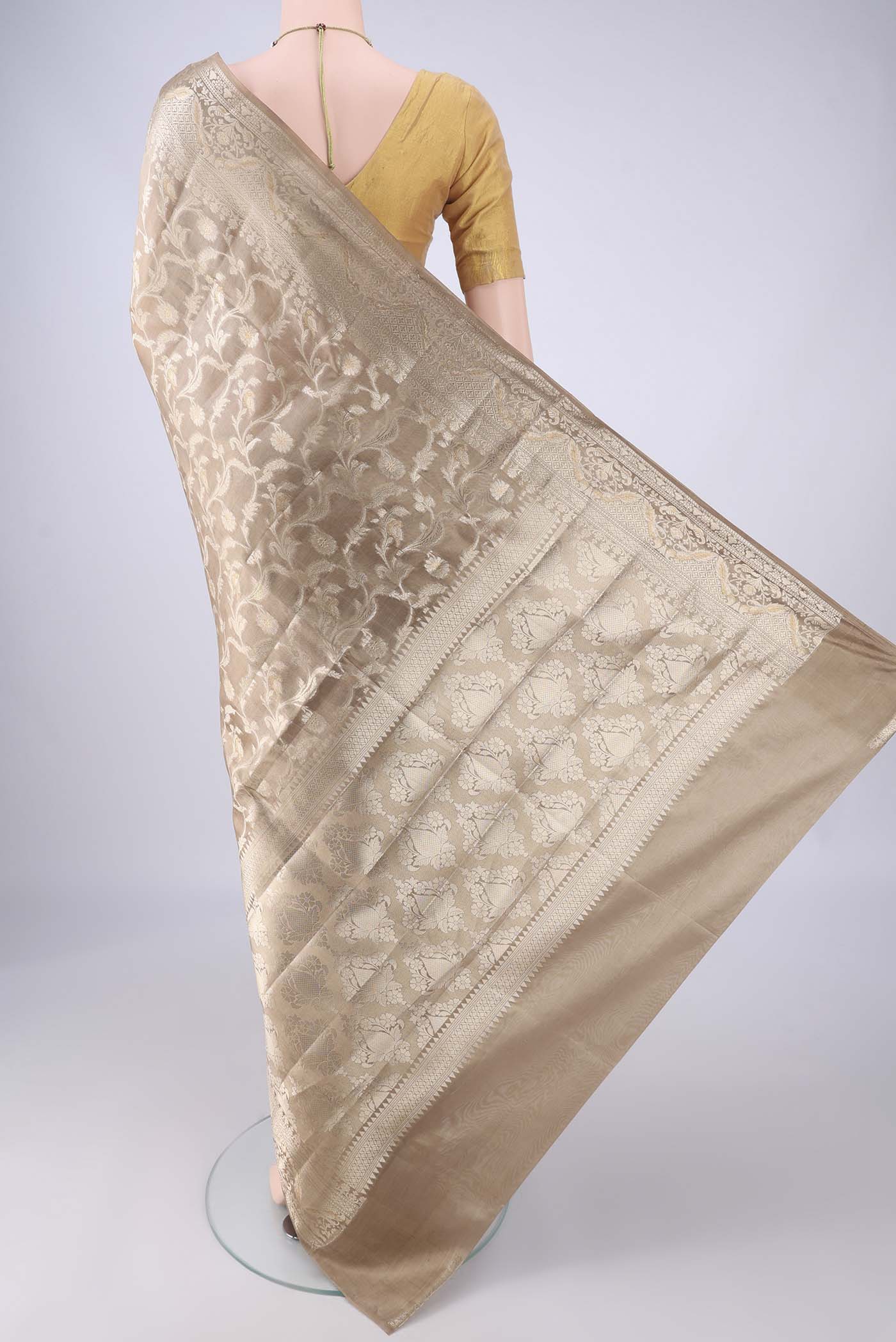 Flat view of Dark Beige Banarasi Raw Silk Saree with Zari Brocade on the body and Zari Border. 
