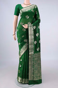 Pure Silk Green Banarasi Tussar Saree with Zari And Thread Butta on the body and Zari Border.  displayed on a mannequin