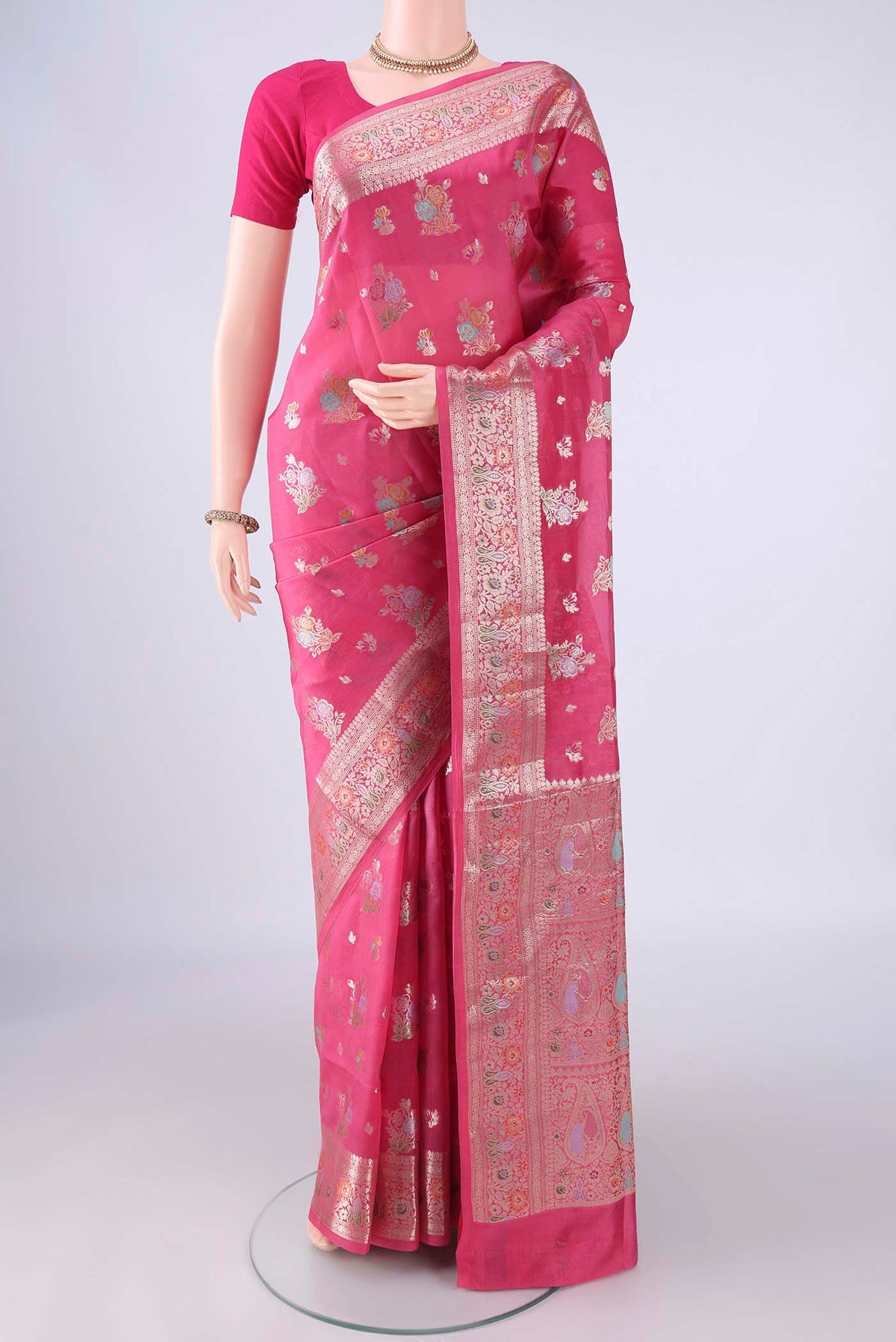 Pink Banarasi Raw Silk Saree with Zari And Thread Butta on the body and Zari Border.  displayed on a mannequin