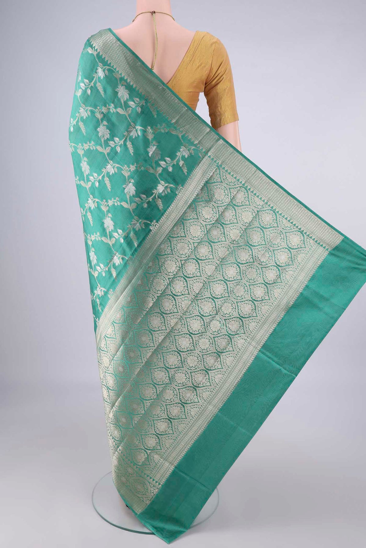 Flat view of Pure Silk Sea Green Banarasi Raw Saree with Zari Brocade on the body and Zari Border. 