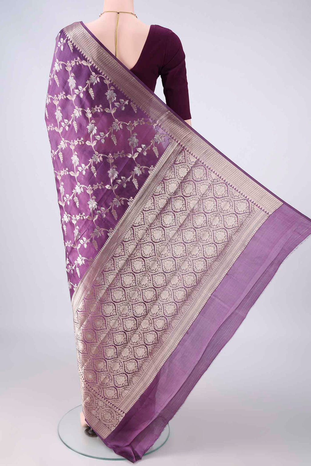 Flat view of Pure Silk Purple Banarasi Raw Saree with Zari Butta on the body and Zari Border. 