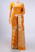 Pure Silk Yellow Banarasi Raw Saree with Zari And Thread Butta on the body and Zari Border.  displayed on a mannequin