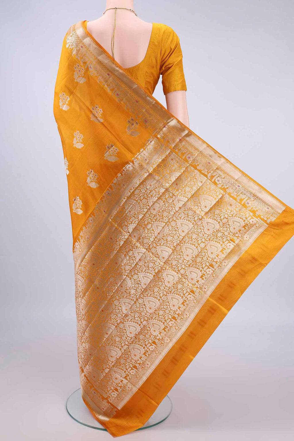 Flat view of Pure Silk Yellow Banarasi Raw Saree with Zari And Thread Butta on the body and Zari Border. 
