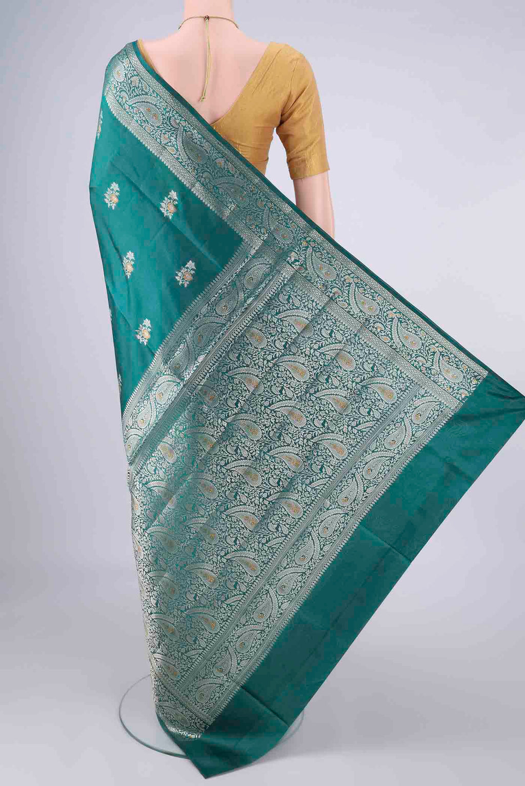 Flat view of Pure Silk Sea Green Banarasi Raw Saree with Zari And Thread Butta on the body and Zari And Thread Border. 