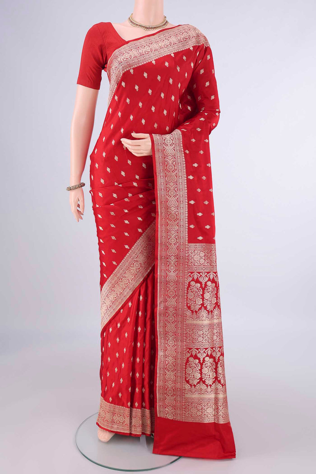Red Banarasi Silk Saree with Zari Butta on the body and Zari Border.  displayed on a mannequin