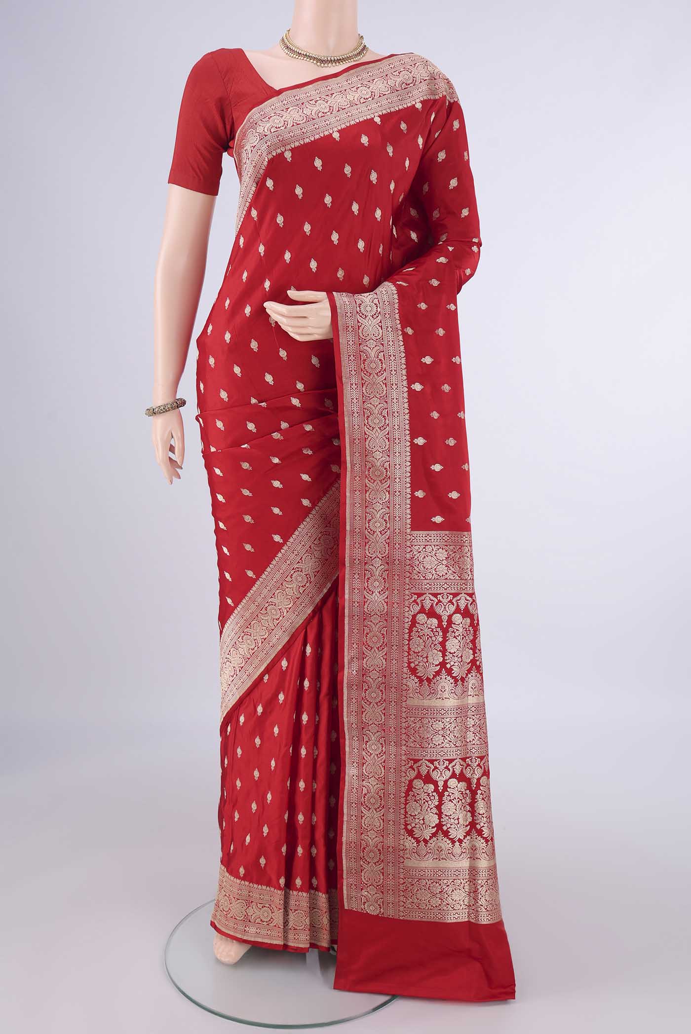 Red Banarasi Silk Saree with Zari Butta on the body and Zari Border.  displayed on a mannequin