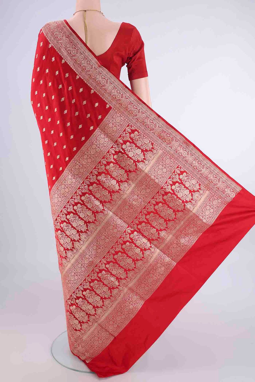 Flat view of Red Banarasi Silk Saree with Zari Butta on the body and Zari Border. 