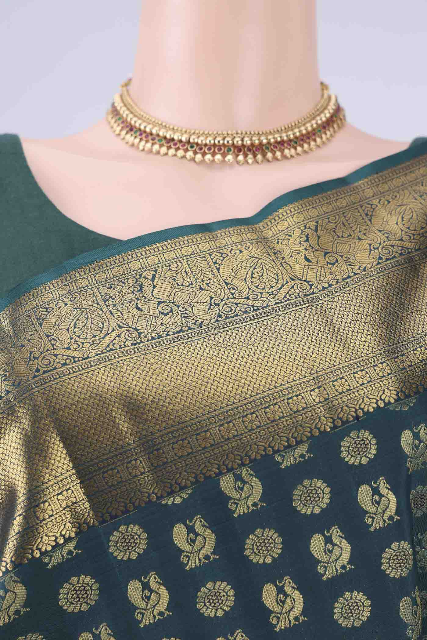 Border image of Bottle Green Kanchipuram Silk Saree with Zari Butta on the body and Zari Border. 