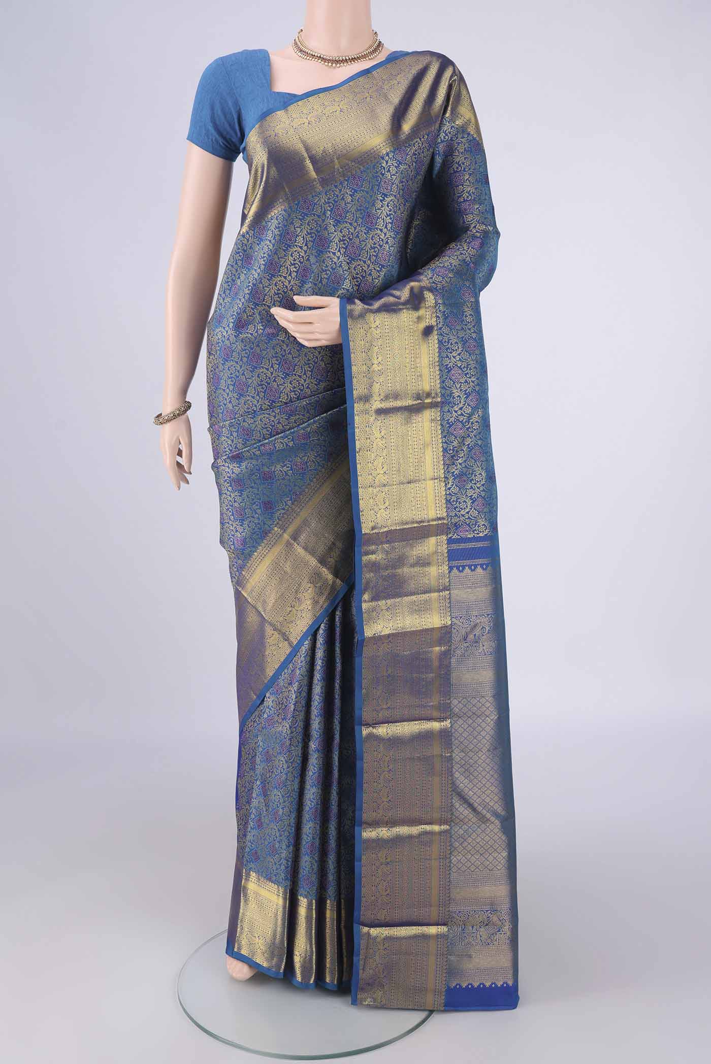 Blue Kanjivaram Silk Saree with Zari Brocade on the body and Zari Border.  displayed on a mannequin
