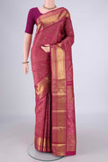 Magenta Kanjivaram Silk Saree with Zari Brocade on the body and Zari Border.  displayed on a mannequin