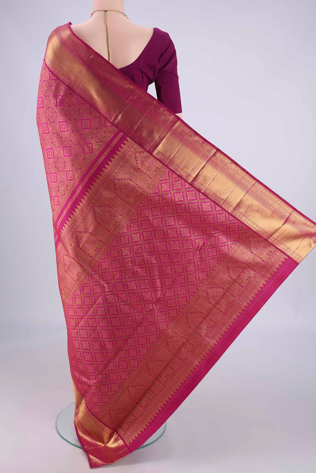 Flat view of Magenta Kanjivaram Silk Saree with Zari Brocade on the body and Zari Border. 