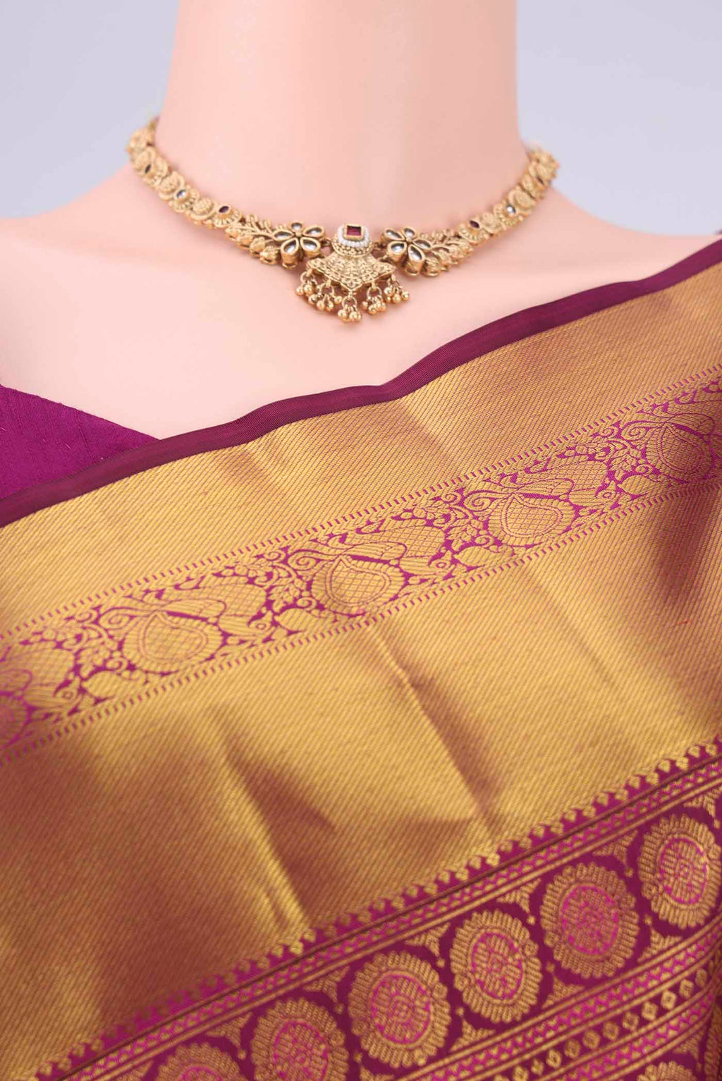 Border image of Burgundy Kanjivaram Silk Saree with Zari Brocade on the body and Zari Border. 
